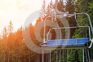 Empty chair ski lift in the summer. Vacation in the mountains ecotourism