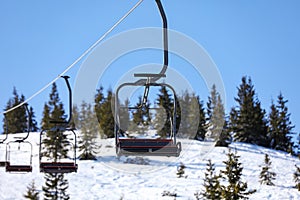 Empty chairlift at mountain ski resort