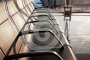 Empty chairs in the airport hallway during covid pandemic in Barcelona, Spain