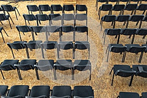 Empty chairs in the assembly hall are arranged in rows, top view