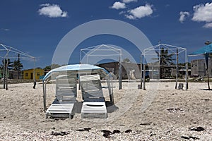 Empty chairs on the beach.