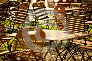 Empty chairs and desks of a garden restaurant