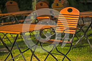 Empty chairs and desks of a garden restaurant