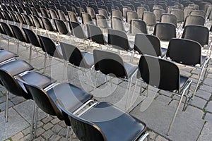 Empty chairs in front of the stage before the concert, background.