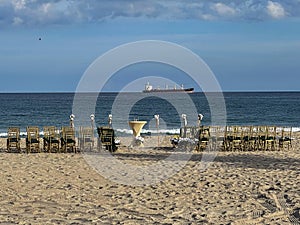 Empty chairs are set up for Florida beach wedding