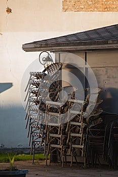 Empty chairs of a summer cafe out of season