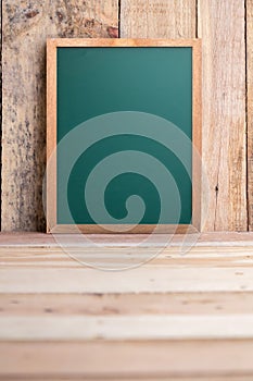 Empty chalkboard with free copy space on rustic wooden plank