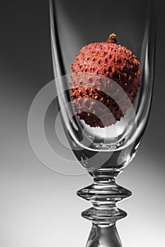 Empty champagne glass with lychee