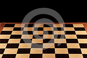 Empty chessboard on a black background