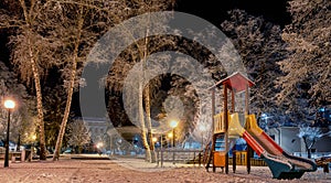 Empty childs playground at night in town