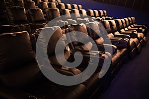 Empty cinema, cinema with soft chairs before the premiere of the film. There are no people in the cinema. Sliding automatic comfor