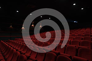 Empty cinema hall with red seats. Movie theatre.