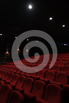 Empty cinema hall with red seats. Movie theatre.