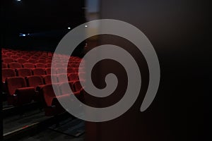 Empty cinema hall with red seats. Movie theatre.