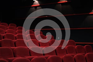 Empty cinema hall with red seats. Movie theatre.