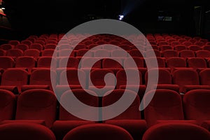 Empty cinema hall with red seats. Movie theatre.