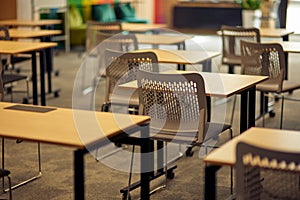 Empty classroom or conference room with desks and chairs
