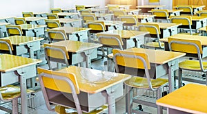 Empty classroom with desks and chairs