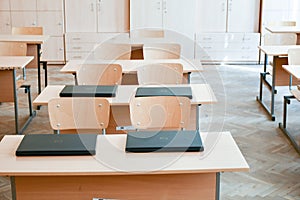 Empty classroom with laptops on desk