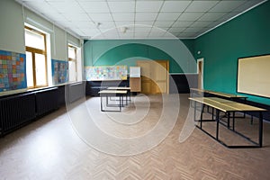 empty classroom, ready for a new school year with chalkboard and blackboard in place
