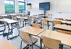 Empty classroom with tables and chairs