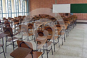 A pile of empty school chairs