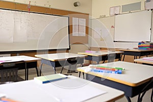 empty classroom with whiteboard and markers, ready for lesson plan