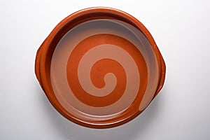 Empty clay plate top view