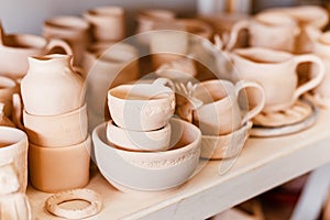 Empty clay pots drying on shelf