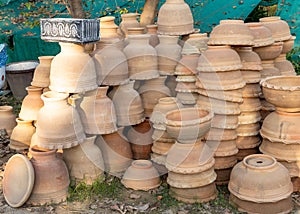 Empty clay pots for plants are displayed for sale