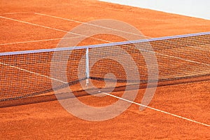 Empty Clay Tennis Court and Net