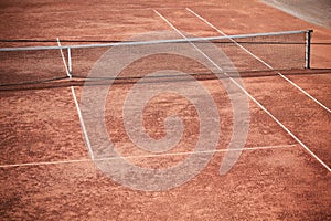 Empty Clay Tennis Court and Net