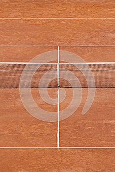 Empty clay tennis court and net. Professional sport concept. Vertical sport poster, greeting cards, headers, website