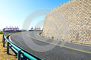 Empty and clean asphalt roads and pier industrial landscape in summe