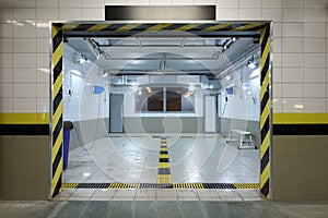 Empty clean car wash room with drainage device, photo