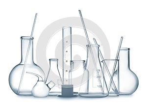 Empty clean laboratory glassware on white background