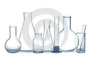 Empty clean laboratory glassware on white background