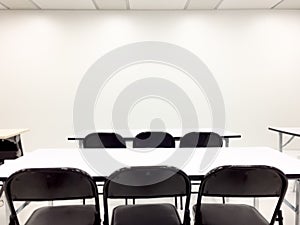 Empty clean room with chairs and tables for training,meeting