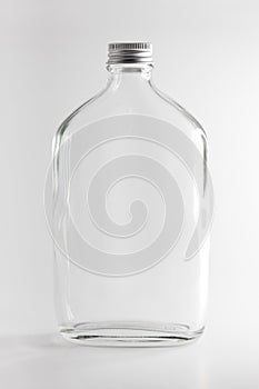 Empty Clear Glass Bottle in white background