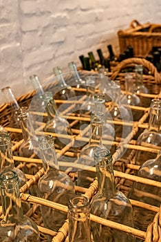 Empty clear glass bottles ready for bottling wine