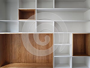 Empty closet shelves background. Modern wooden wardrobe boxes, beautiful white and brown interior design combination, abstract