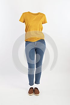 Empty clothes invisible sexy Woman wearing yellow t shirt and tight jeans with shoes posing