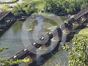 Empty coal cars crossing railroad bridge