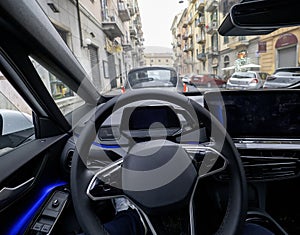 Empty cockpit electric vehicle, Head Up Display and digital speedometer. Steering wheel of electric vehicle, interior, cockpit,