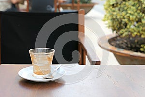 Empty coffee cup on cafe table in Ciutadella