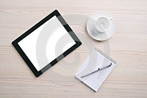 Empty coffee cup, notebook, pen, digital tablet pc with blank sc