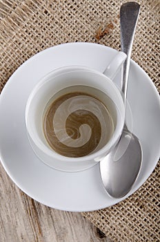 Empty coffee cup with a spoon
