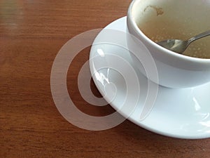 Empty coffee cup on wood table