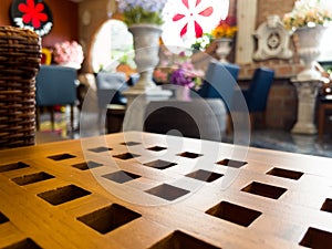 The empty coffee table over defocused coffee shop background