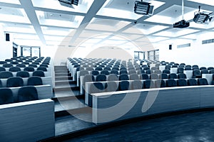 Empty college lecture hall with chairs photo